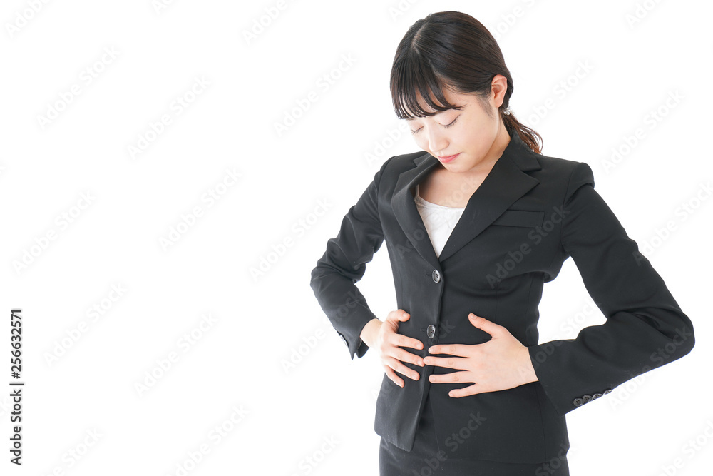 腹痛に苦しむ若いビジネスウーマン 腹痛に苦しむ若いビジネスウーマン