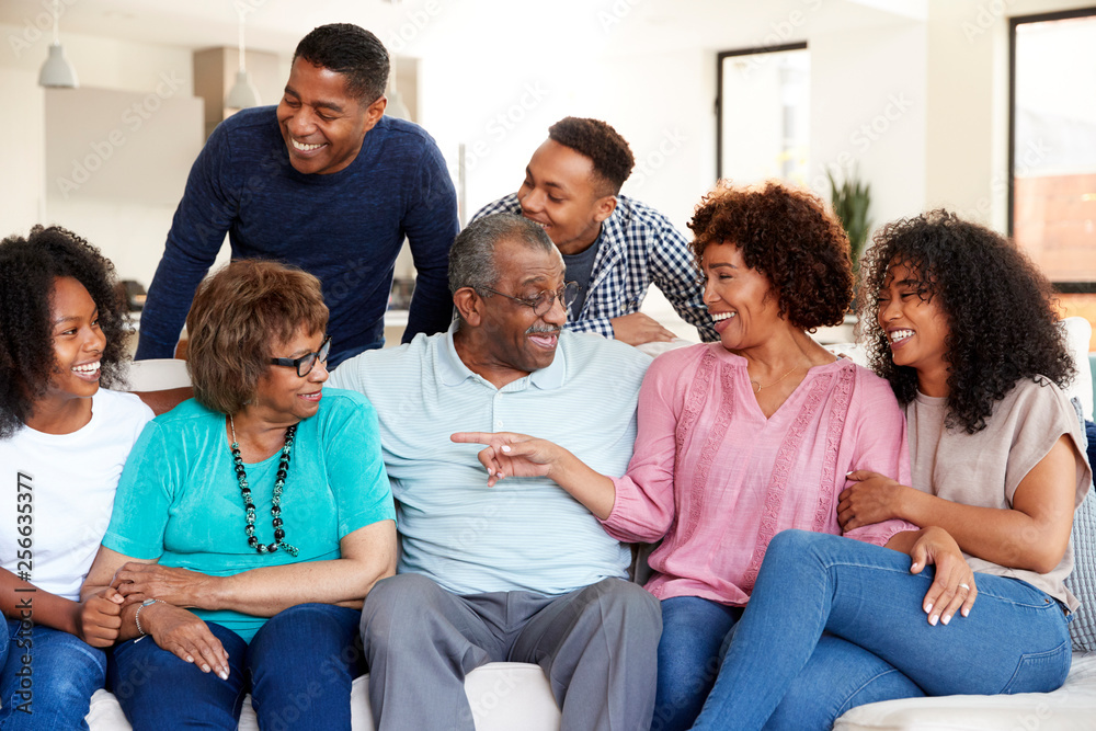 Happy multi generation black family relaxing together at home Happy multi generation black family relaxing together at home