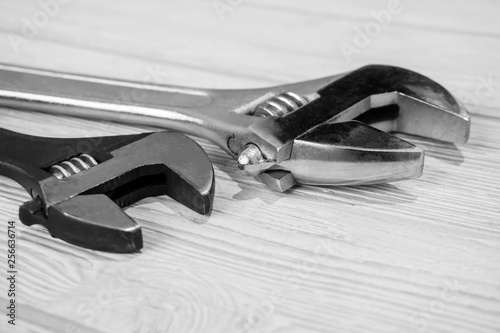 two adjustable wrenches on the table close up photo