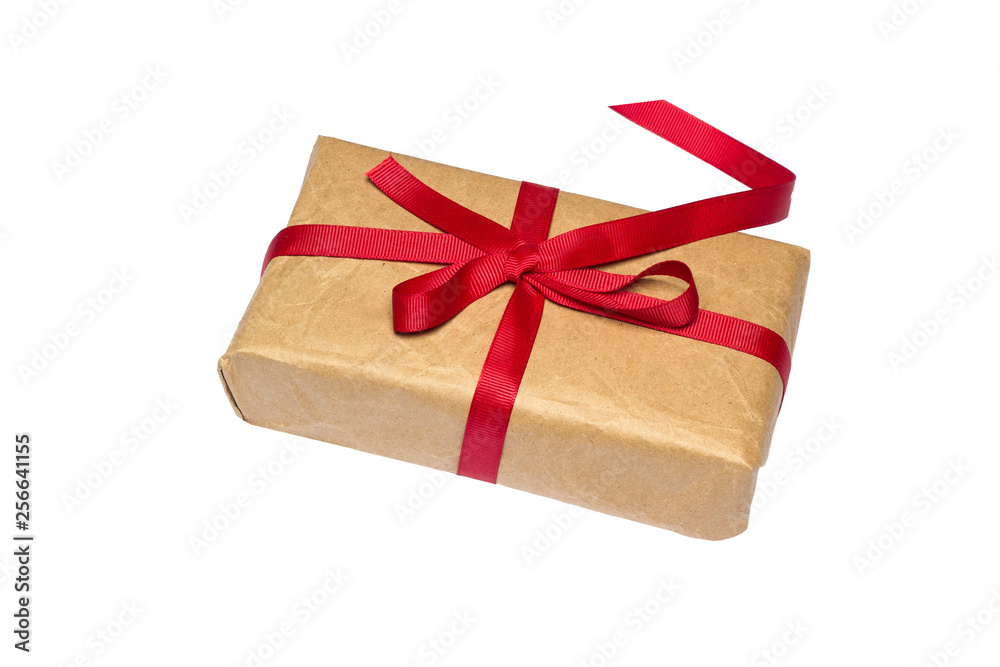 Gift box wrapped in brown recycled paper with red ribbon isolated on white background. Gift box wrapped in brown recycled paper with red ribbon isolated on white background.