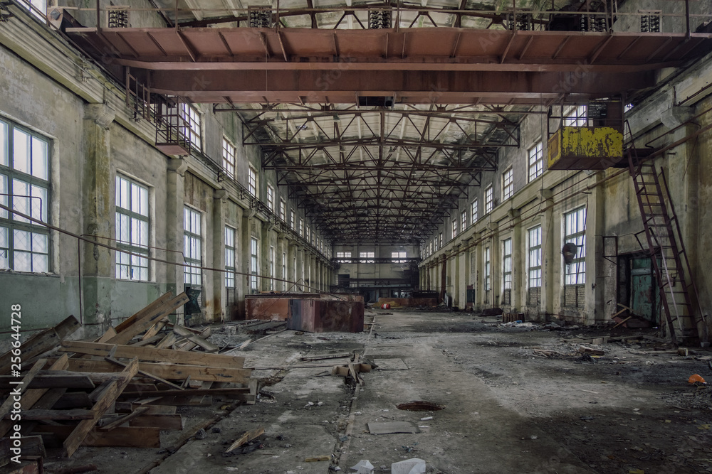 Abandoned industrial building with rusty bridge crane