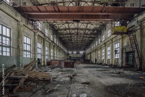 Abandoned industrial building with rusty bridge crane