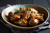 Teriyaki chicken wings with sesame and green onions