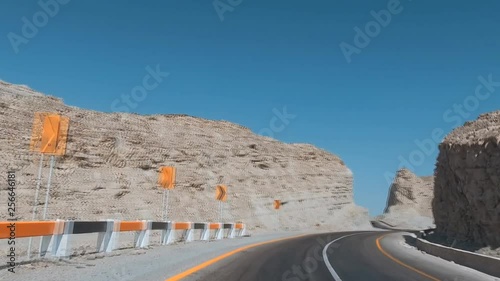 driving along the road in the mountainous terrain of Pakistan photo