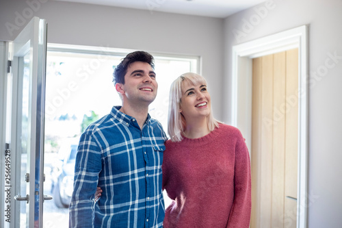 Young Couple Looking Around New Home To Rent Or Buy Together