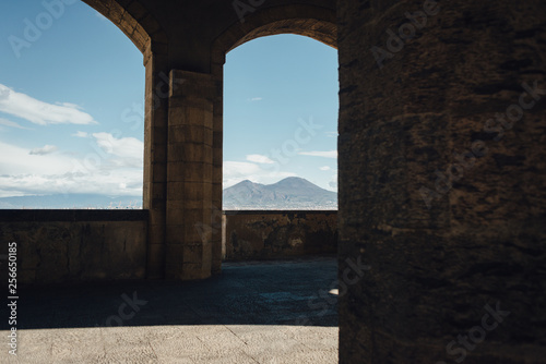 Vesuvius view through the castle Castel dell Ovo arches