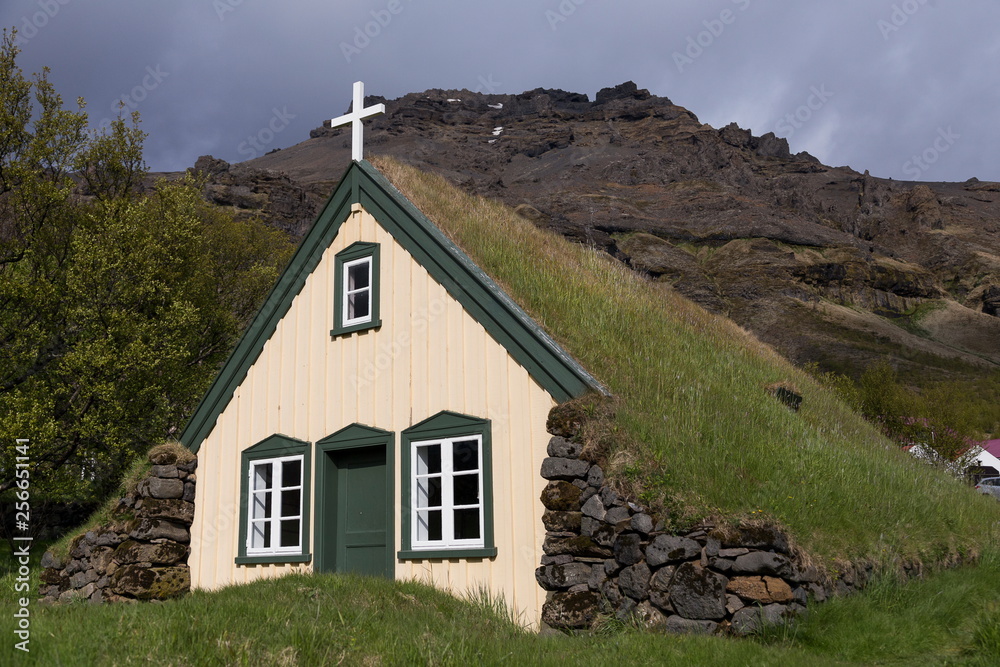 Traditional turf roofed rural church in Iceland