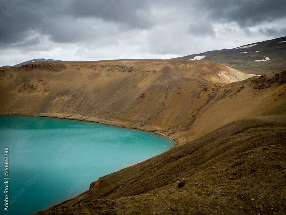 Green crater lake in old volcano Iceland