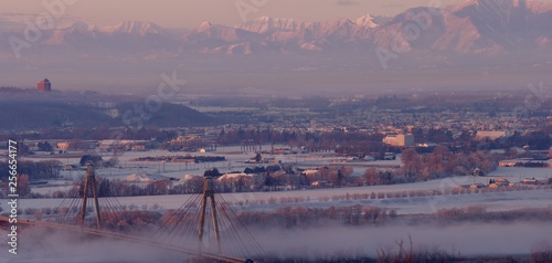 Fotografie Obihiro city and Hidaka mountains in dawn light