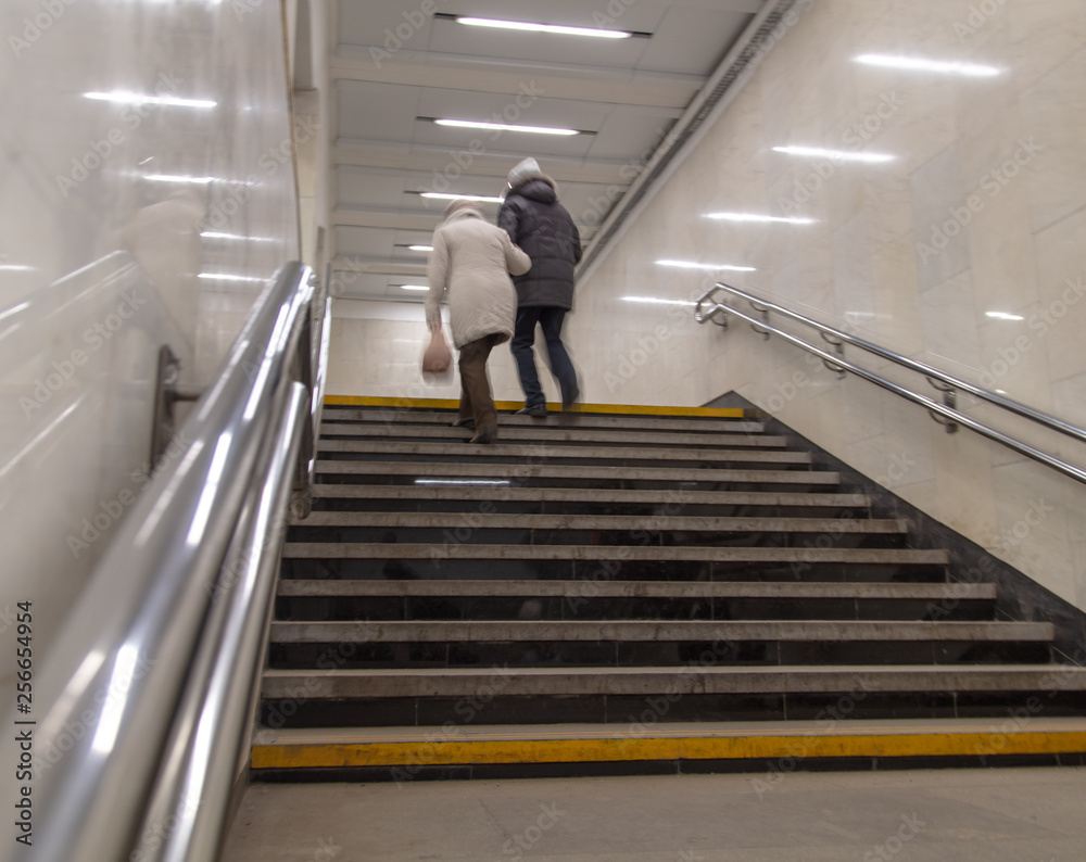 People walk the underpass in motion People walk the underpass in motion