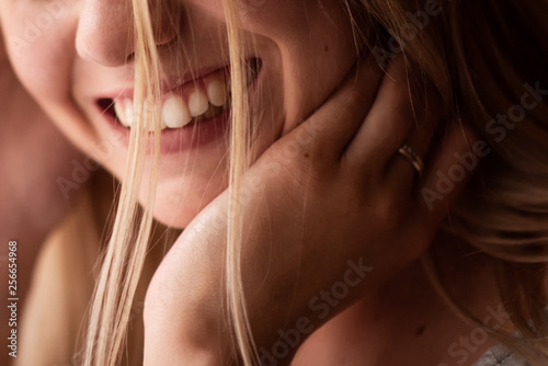 Female smiling, closeup of perfect teeth.