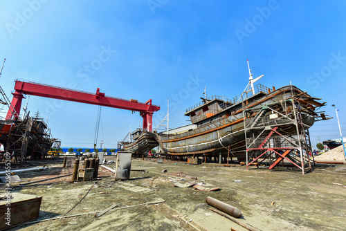 Close-ups of various vessels undergoing maintenance and repair