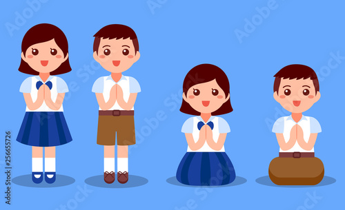 Thai student boy and girls pay respect.