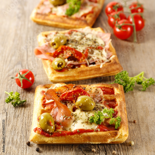 waffle pizza with tomato, ham and olive