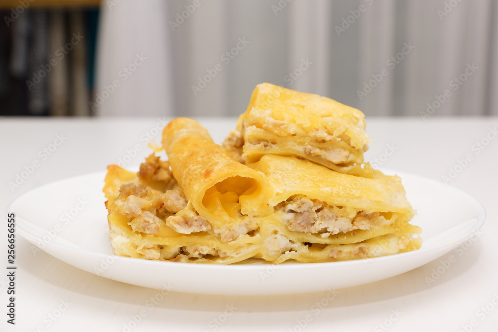 fragrant lasagna on a white plate fragrant lasagna on a white plate