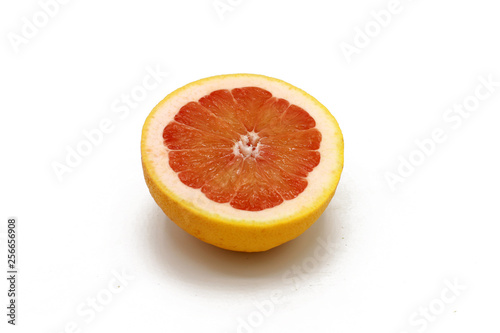 sliced fresh half grapefruits - isolated on white