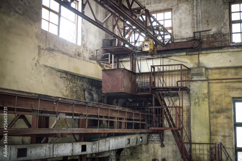 Old rusty gantry crane in abandoned factory