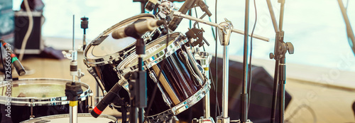 Modern drum set on stage prepared for playing.