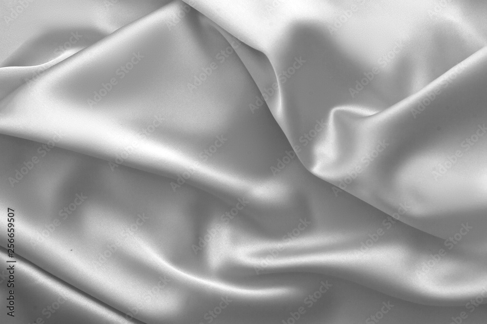 Fototapeta premium Rippled white silk fabric satin cloth waves background