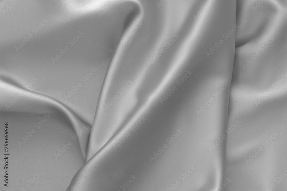 Fototapeta premium Rippled white silk fabric satin cloth waves background