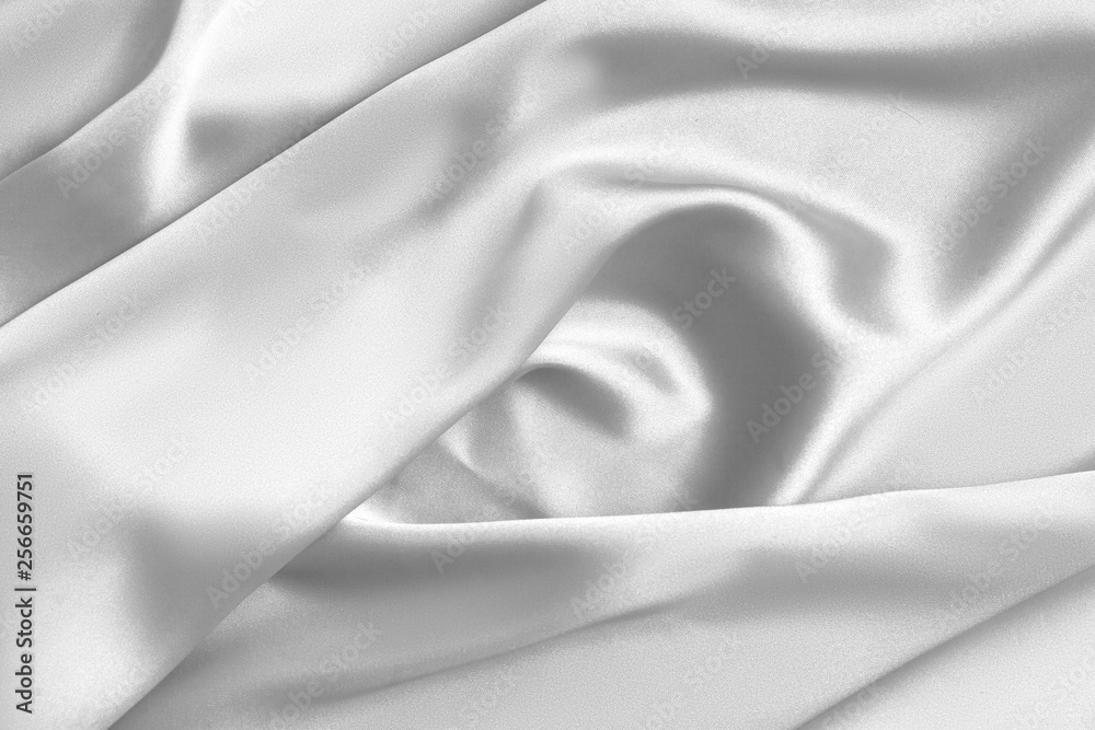 Fototapeta premium Rippled white silk fabric satin cloth waves background