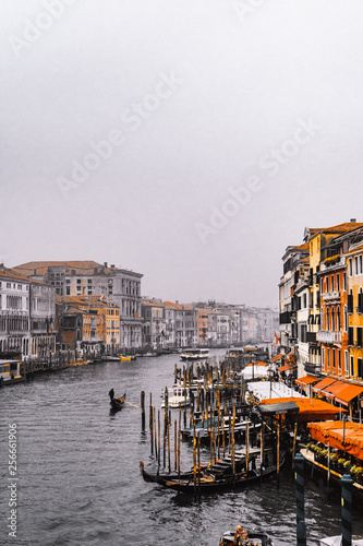Venice / Italy 19 february 2019 :view of the Canal in Venice from Rialto bridge,gondolas are crossing the river and people enjoy their winter vacations