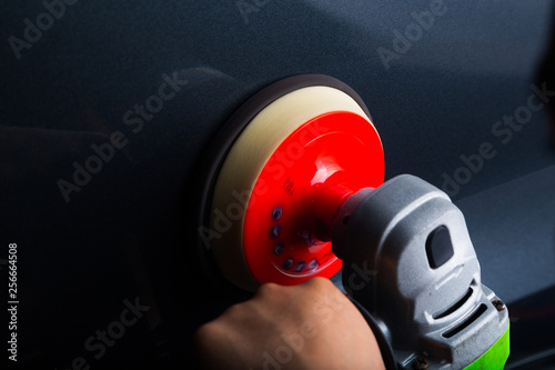 Close up of rotary machine detailing car panel © camerarules