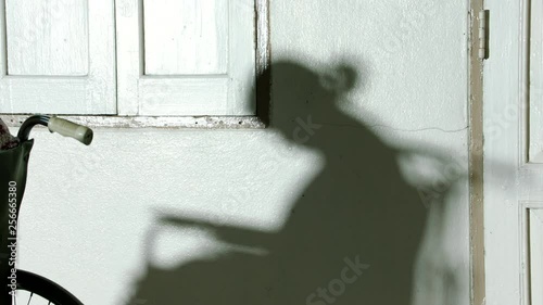 Shadow of old women sitting and sleep on Wheel chair