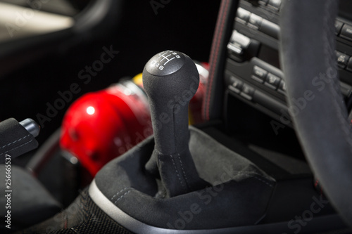 Close up of gear stick in sports car interior photo