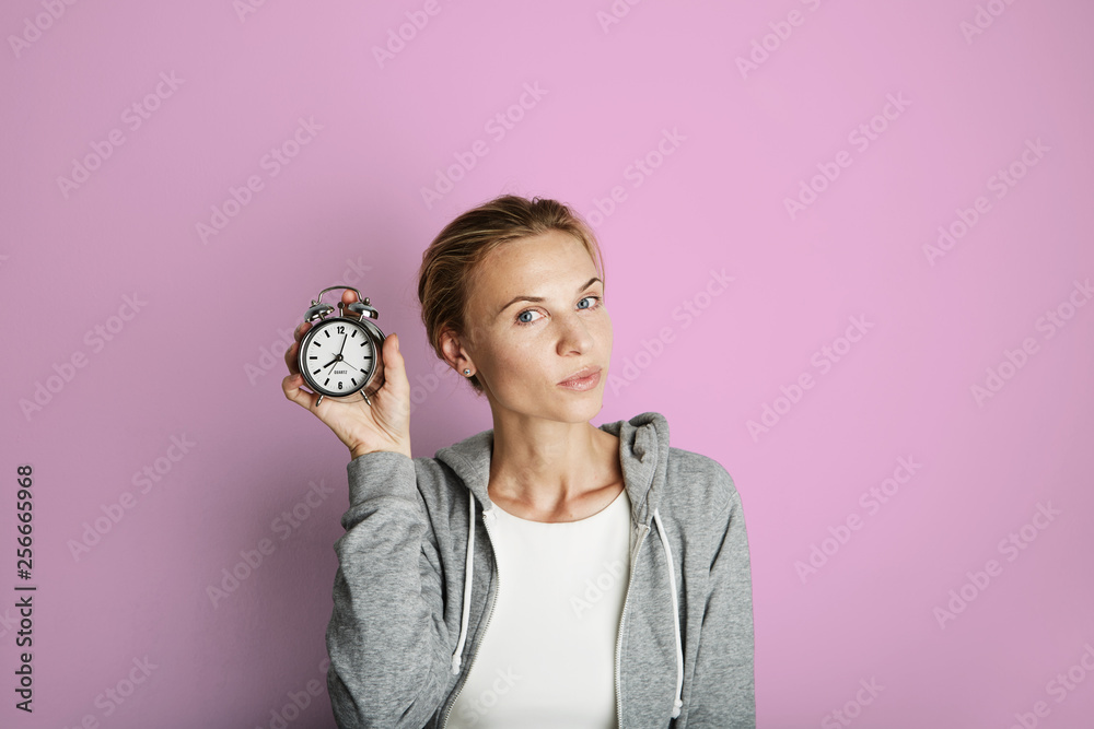 Portrait Handsome Young Woman Posing Blank Pink Background.Pretty Girl Smiling Holding Vintage Alarm Clock Hand Empty Wall.Beauty Lifestyle Fashion Hipster People.Casual Time Abstract Concept. Portrait Handsome Young Woman Posing Blank Pink Background.Pretty Girl Smiling Holding Vintage Alarm Clock Hand Empty Wall.Beauty Lifestyle Fashion Hipster People.Casual Time Abstract Concept.