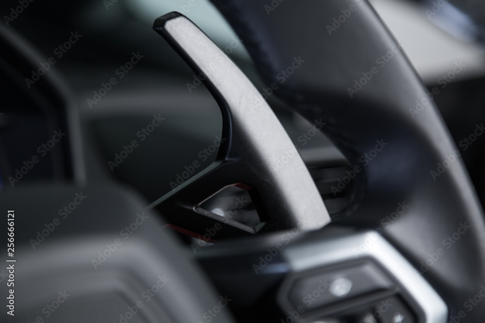 Paddle shifting in sports car interior