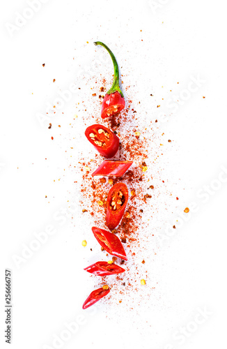 Stampa su tela Red chili pepper, cut into pieces and isolated on white background