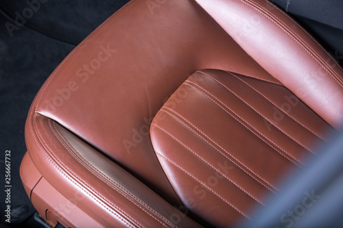 Detail shot of brown leather car seat