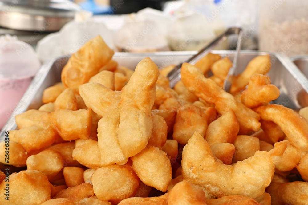 Deep-fried dough stick at market Deep-fried dough stick at market
