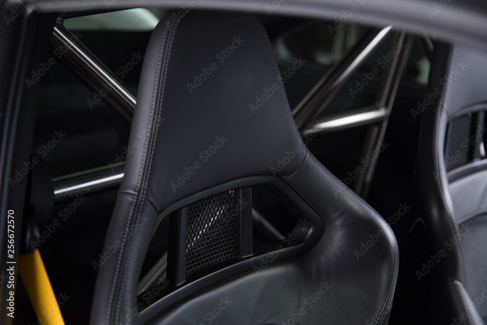 Black leather headrest on sports car seat