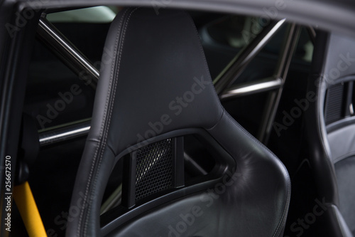 Black leather headrest on sports car seat