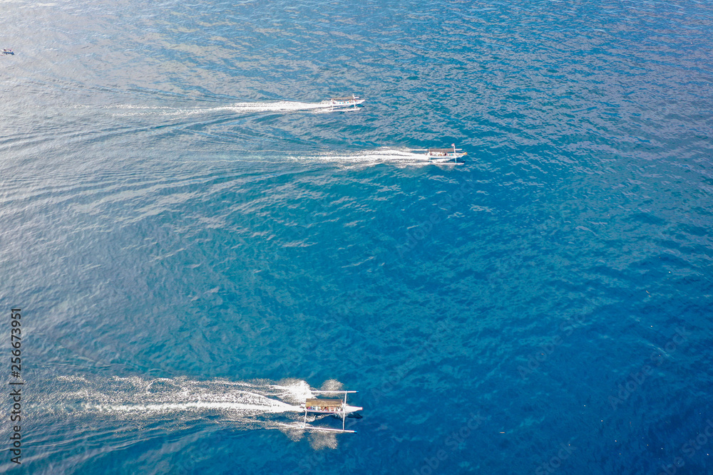 Naklejka premium Traditional balinese fisherman's boats in the ocean, Lovina, Bali, Indonesia