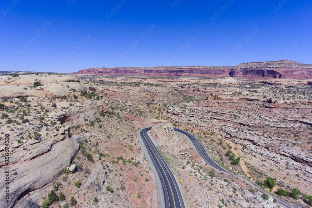 Mesa and canyon landscape and Utah State Route 313 aerial view near Arches National Park, Moab, Utah, USA.