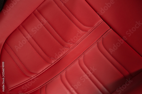 Close up of red leather car seat