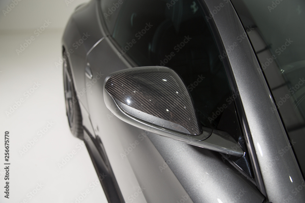 Carbon fibre mirror cap on grey car