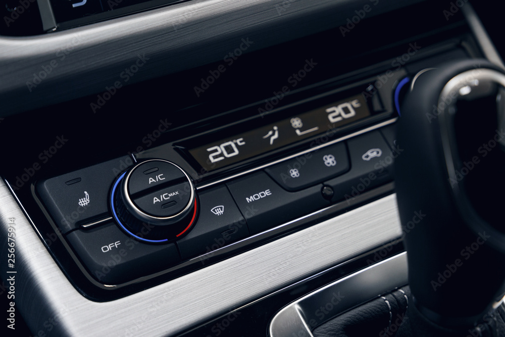 Air conditioning button inside a car. Climate control unit in the new car. Modern car interior details. Car detailing. Selective focus