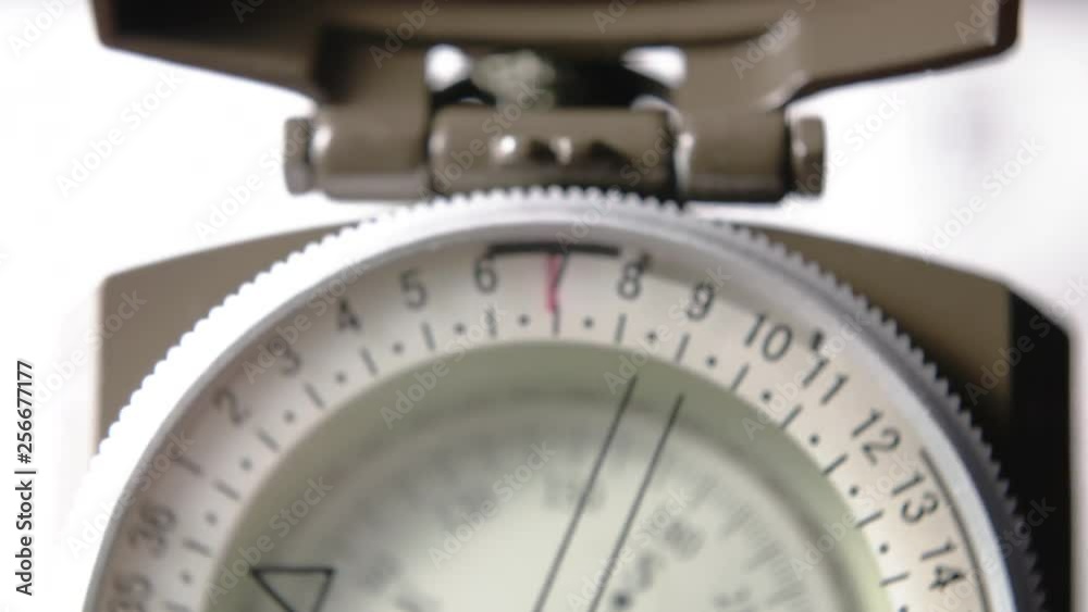 Face of Lensatic Compass CLOSE UP TILT DOWN Face of Lensatic Compass CLOSE UP TILT DOWN