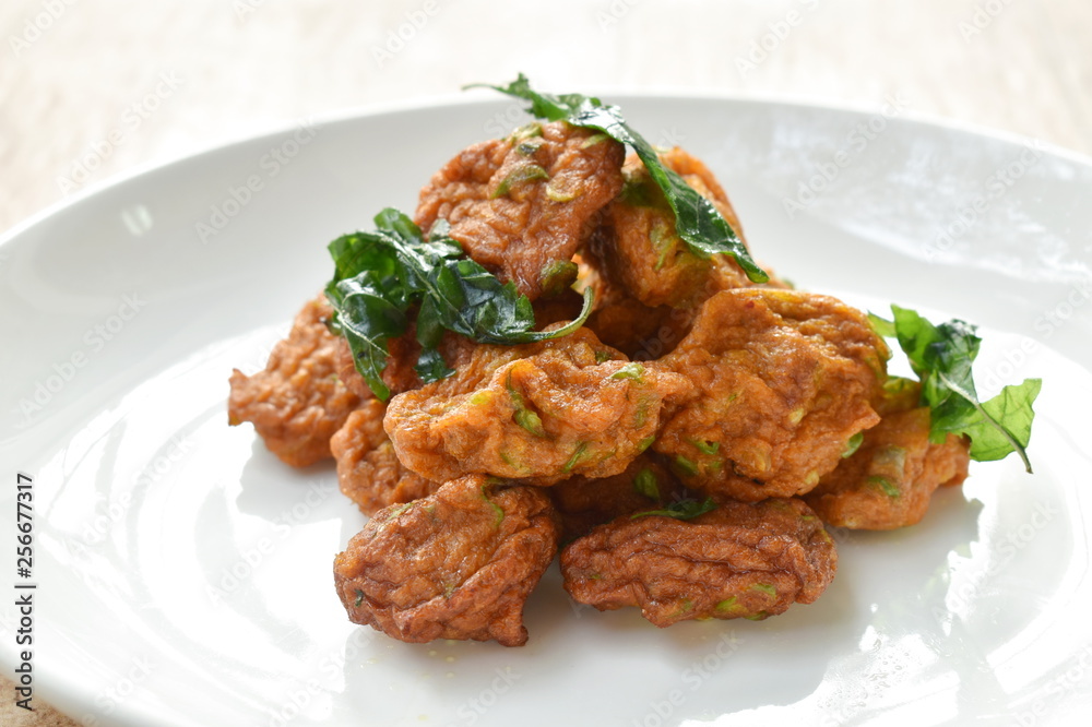 fried fish cake topping crispy fried basil leaf on dish fried fish cake topping crispy fried basil leaf on dish