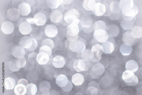 Silver glitter festive background with bokeh lights. Celebration concept for Holidays and anniversary.