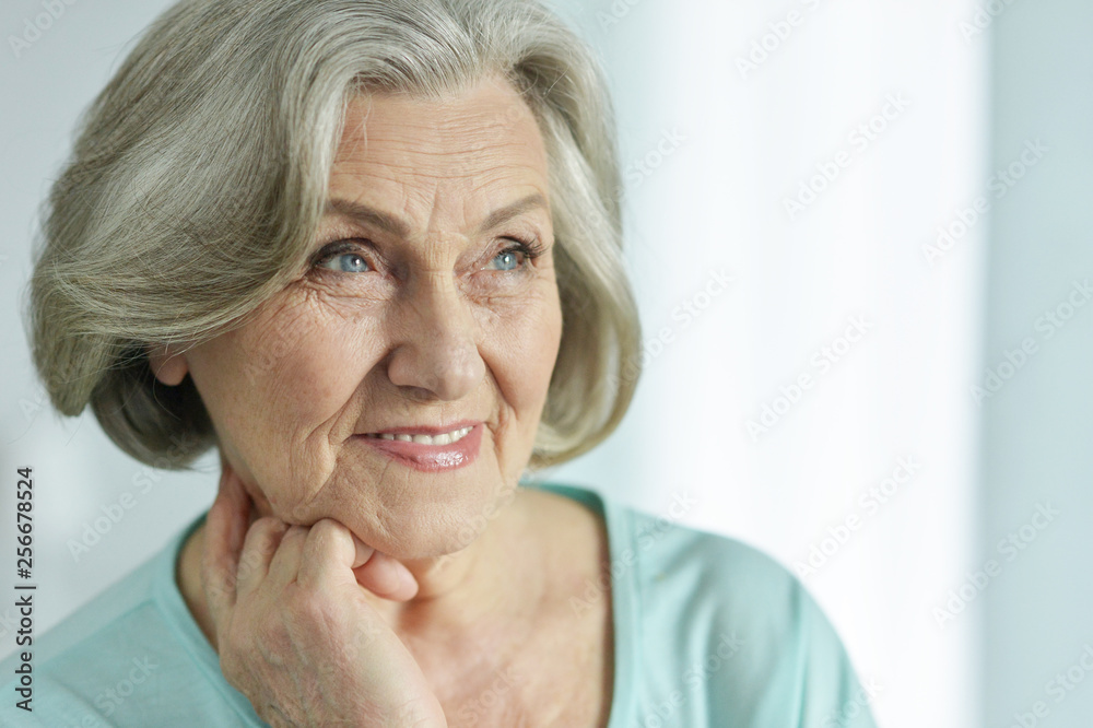Close-up portrait of cute happy senior woman posing Close-up portrait of cute happy senior woman posing