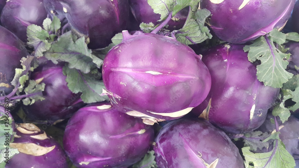 Fruits background: Purple fresh kohlrabi turnip in supermarket for sale Fruits background: Purple fresh kohlrabi turnip in supermarket for sale