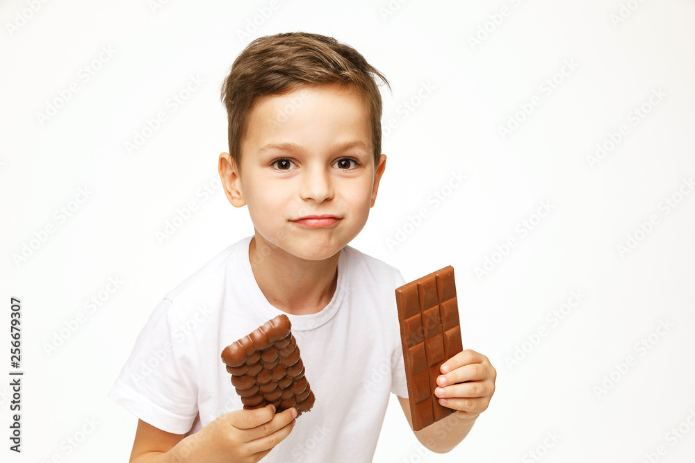 little beautiful boy holding chocolates studio shot little beautiful boy holding chocolates studio shot