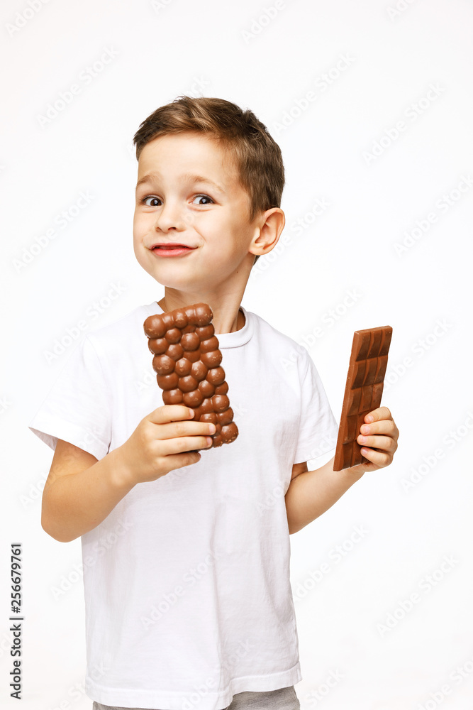 little beautiful boy holding chocolates studio shot little beautiful boy holding chocolates studio shot