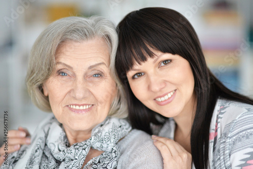 Close-up portrait of senior woman with daughter