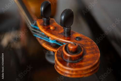 violin in vintage style on wood background close up